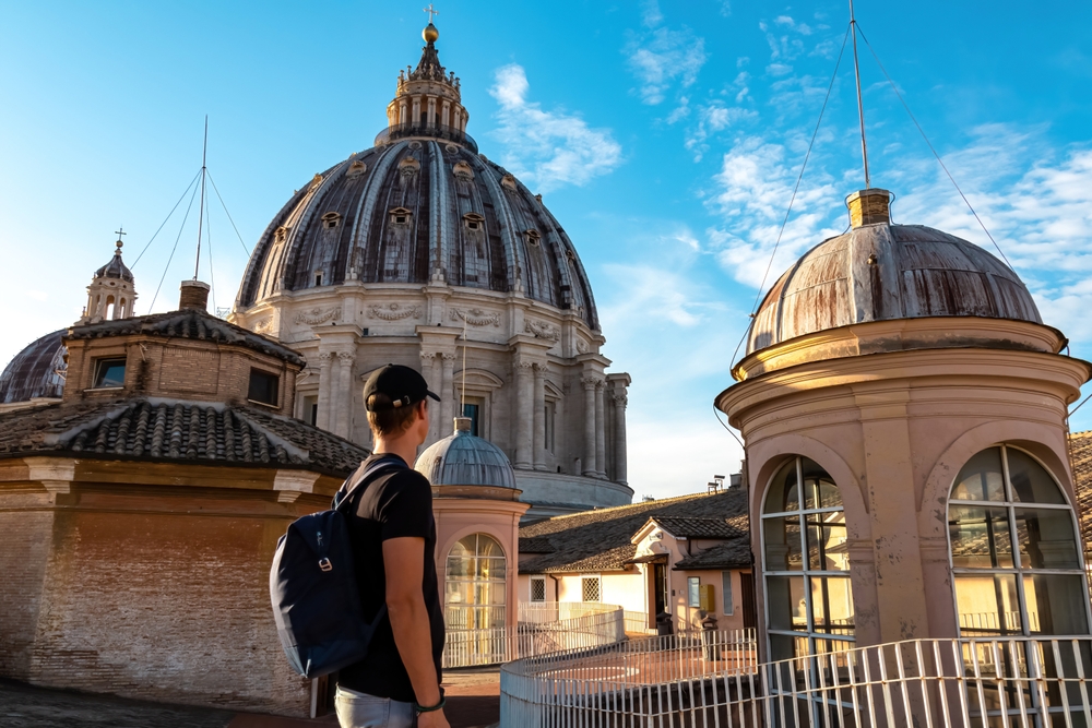 tourist looking at st peters dome, rome