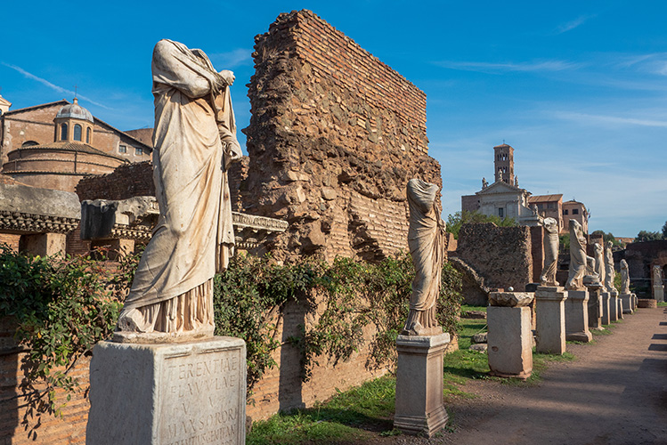 ruins in the roman forum of statues of the virgins of vesta