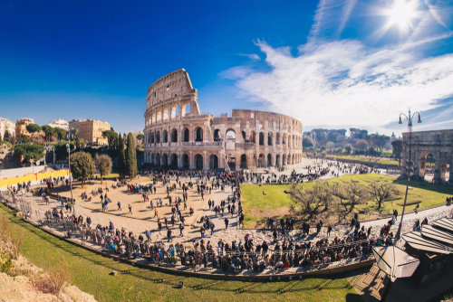 colosseum view from afar with tourists